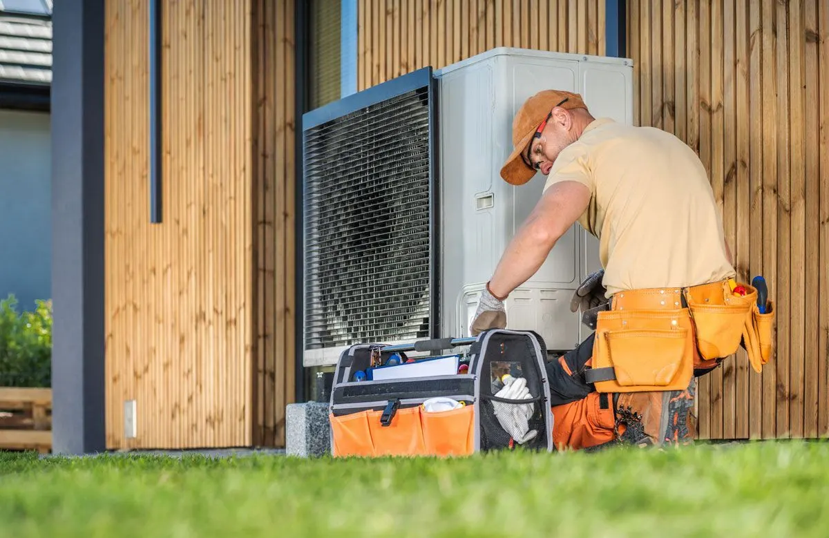 Comfort Central technician servicing an HVAC system